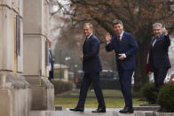 The new Polish Prime Minister Donald Tusk, left, Jan Grabiec, chief of staff, center, and newly appointed Minister of Digital Affairs Krzysztof Gawkowski, arrive at the Prime Minister's office in Warsaw, Poland, Wednesday, Dec. 13, 2023. (AP Photo/Michal Dyjuk)