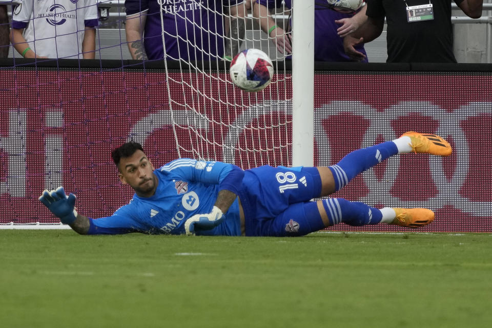 Toronto FC goalkeeper Greg Ranjitsingh blocks a shot by Orlando City during the first half of an MLS soccer match Tuesday, July 4, 2023, in Orlando, Fla. (AP Photo/John Raoux)