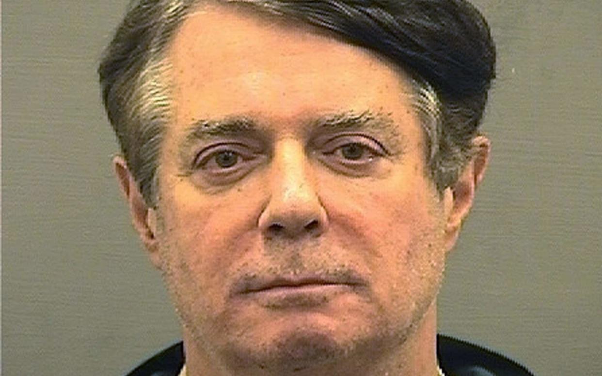 Paul Manafort in a police mugshot - REUTERS