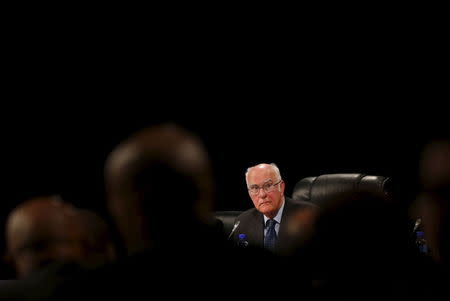 Retired judge Ian Farlam listens as the judicial commission of inquiry into the shootings at Lonmin's Marikana mine gets underway in Rustenburg, in this file picture taken October 1, 2012. REUTERS/Mike Hutchings/Files