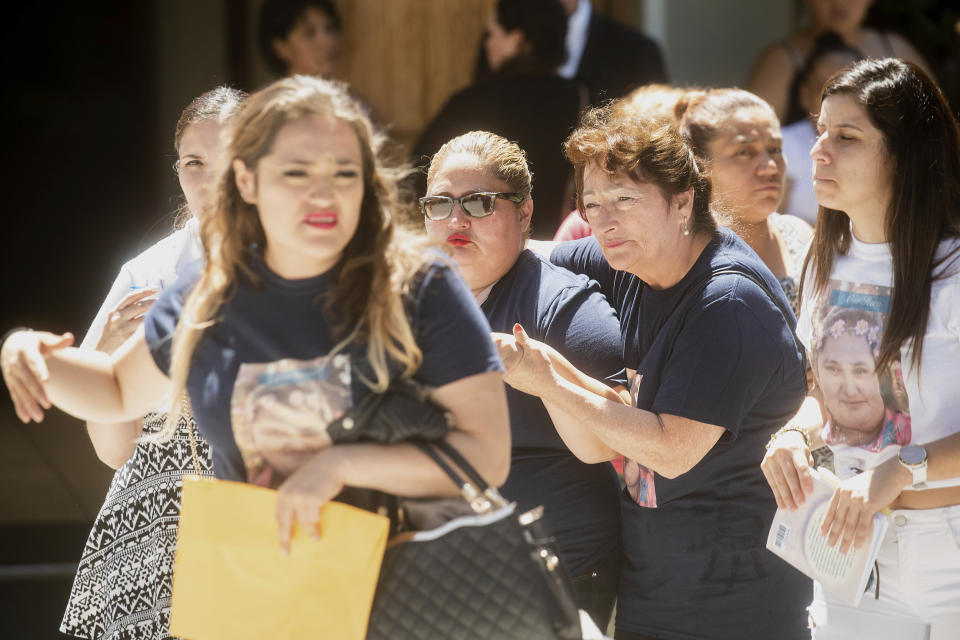 Lorena Pimentel de Salazar, center, leaves a funeral for her daughter Keyla Salazar, 13, on Tuesday, Aug. 6, 2019, in San Jose, Calif. Salazar and two others were killed when a gunman opened fire at the Gilroy Garlic Festival July 28. (AP Photo/Noah Berger)