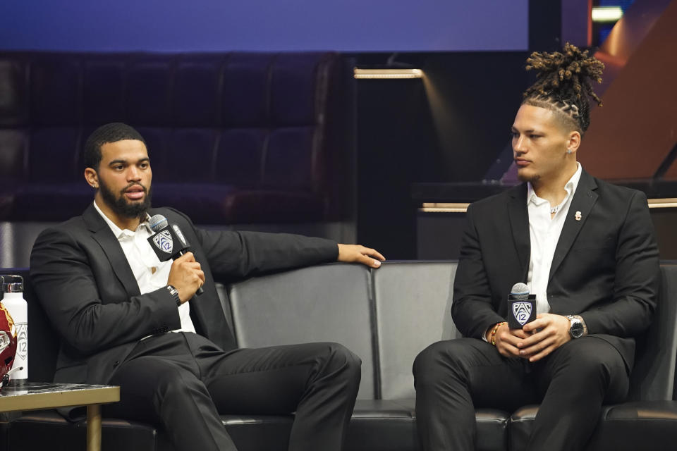 USC quarterback Caleb Williams, left, answers questions with linebacker Mason Cobb at the NCAA college football Pac-12 media day Friday, July 21, 2023, in Las Vegas. (AP Photo/Lucas Peltier)