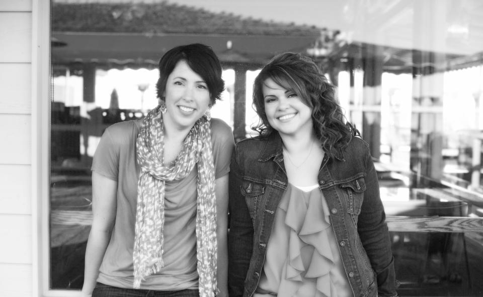 In this undated photo provided by Christina Lauren, Lauren Billings, left, and Christina Hobbs pose for a photo together. Over the past decade, Billings and Hobbs have combined to write best-selling adult and young adult novels under the name “Christina Lauren.” They started out with romance books, among them such very adult stories as “Beautiful Bombshell," “Wicked Sexy Liar" and the upcoming “The Honeydon't List." Meanwhile, for young adult novels such as “Autoboyography" and “The House," they adapt themes of love and desire for a more impressionable and sensitive audience. (Alyssa Michelle/Christina Lauren via AP)