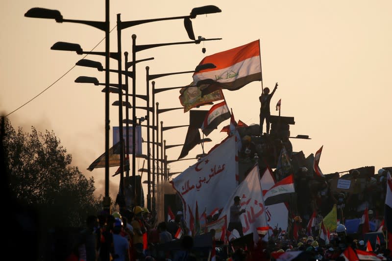 Iraqi demonstrators attend an anti-government protest in Baghdad