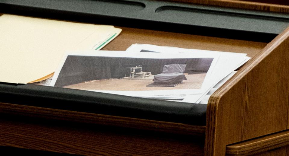 Josh Kendrick, center, attorney for the plaintiff, shows images in court for the trial regarding the state's death penalty, at Richland County Courthouse, in Columbia, Tuesday, August 2, 2022.