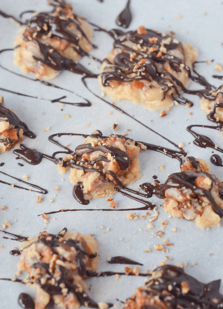 <p>These mini pecan pie clusters from <a href="https://www.heyketomama.com/keto-pecan-pie-clusters/" rel="nofollow noopener" target="_blank" data-ylk="slk:Hey Keto Mama;elm:context_link;itc:0;sec:content-canvas" class="link ">Hey Keto Mama </a>give you the dessert you want but in a small fun-size version to keep carbs, calories, and <a href="https://www.menshealth.com/nutrition/a28861453/healthy-natural-sweeteners/" rel="nofollow noopener" target="_blank" data-ylk="slk:sugar in check;elm:context_link;itc:0;sec:content-canvas" class="link ">sugar in check</a>. Use dark and sugar-free chocolate to make the total sugar zero. Each cluster is just 140 calories.</p>