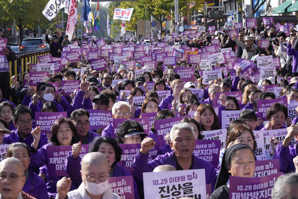 Family members of the victims shout slogans during a service to mark the first anniversary of the harrowing crowd surge that killed about 160 people in a Seoul alleyway, at the Itaewon district in Seoul, South Korea, Sunday, Oct. 29, 2023. (AP Photo/Ahn Young-joon)