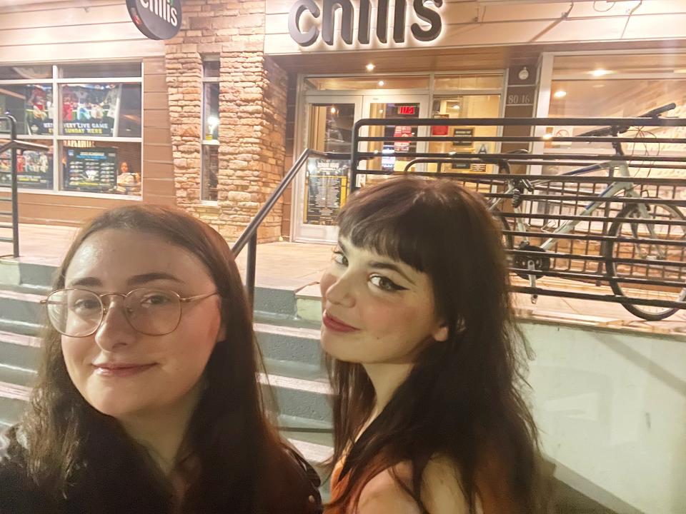 author and guest outside chilis restaurant