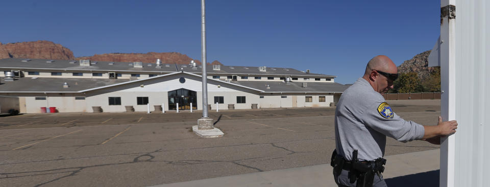 This Oct. 25, 2017, photo shows the meetinghouse in Colorado City, Ariz. A polygamous group known as the Fundamentalist Church of Jesus Christ of Latter Day Saints, or FLDS, is letting go of the sprawling building where its members worshipped, in the latest sign that the sect run by imprisoned leader Warren Jeffs is crumbling and losing control of the community it ruled for a century. (AP Photo/Rick Bowmer)