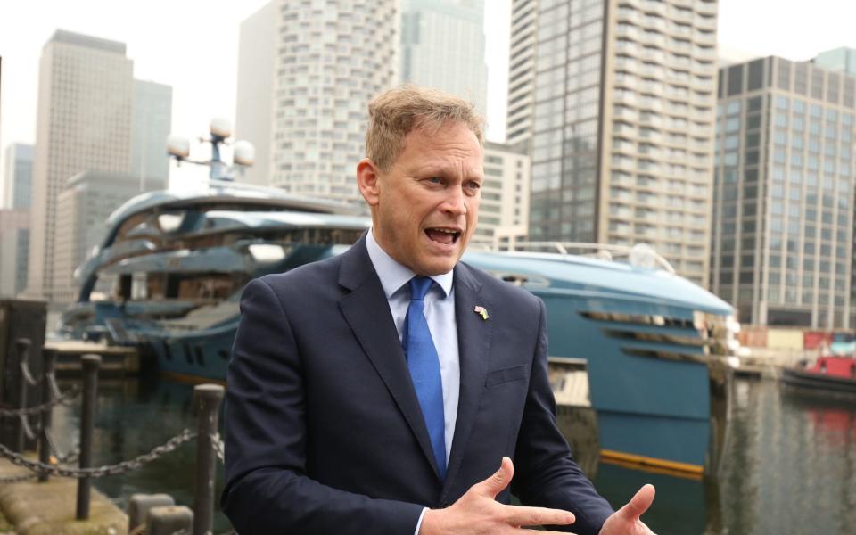 Transport Secretary Grant Shapps by the superyacht Phi owned by a Russian businessman in Canary Wharf, east London which has been detained as part of sanctions against Russia. The vessel is the first to be detained in the UK under sanctions imposed because of the war in Ukraine. Picture date: Tuesday March 29, 2022 - James Manning/ PA