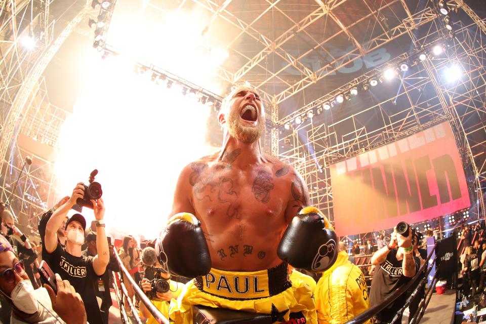 Jake Paul celebrates after defeating Ben Askren in their boxing match.