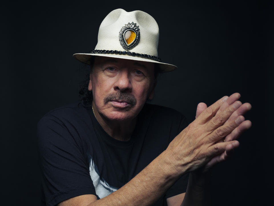 Carlos Santana poses for a portrait on Friday, June 16, 2023, in New York. (Photo by Drew Gurian/Invision/AP)