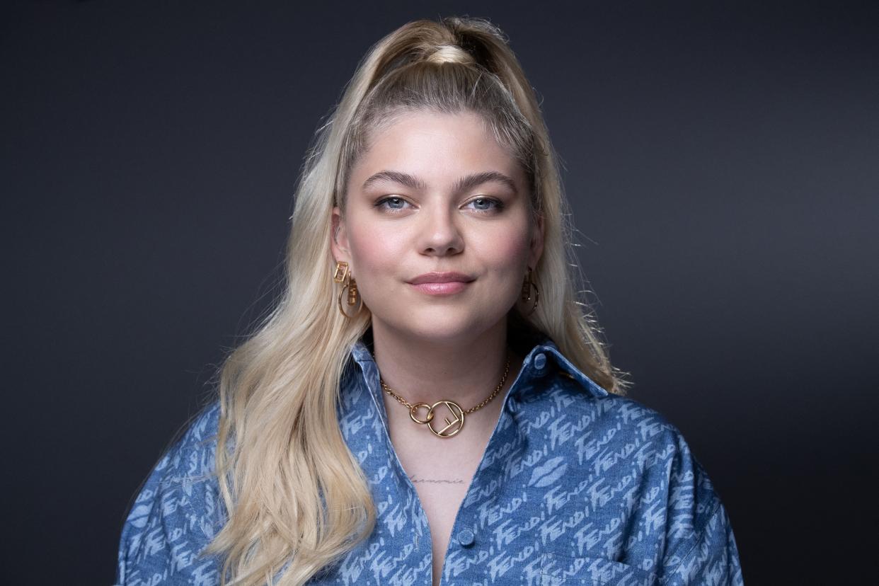 TOPSHOT - French singer and actress Louane poses for a photo session during the 5th edition of the Cannes International Series Festival (Canneseries) on April 3, 2022 in Cannes, southern France. (Photo by JOEL SAGET / AFP) (Photo by JOEL SAGET/AFP via Getty Images)