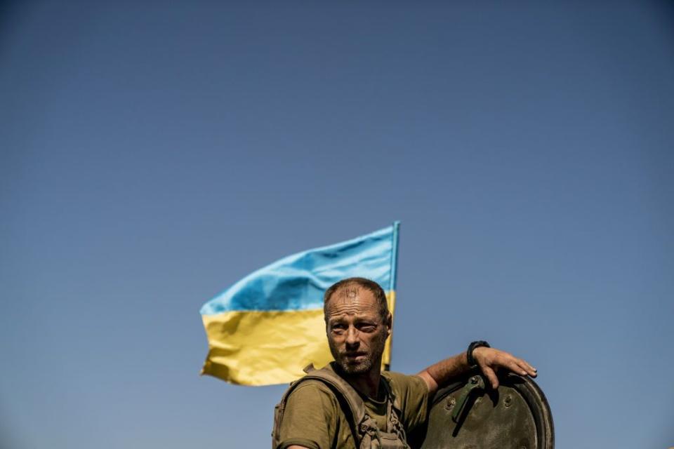 A Ukrainian soldier is seen in a BMP-1 Infantry Fighting Vehicle with a Ukrainian flag during a military training of the Ukrainian Army near Chasiv Yar as the Russia-Ukraine war continues in Donetsk Oblast, Ukraine on Aug. 19, 2023. (Photo by Jose Colon/Anadolu Agency via Getty Images)