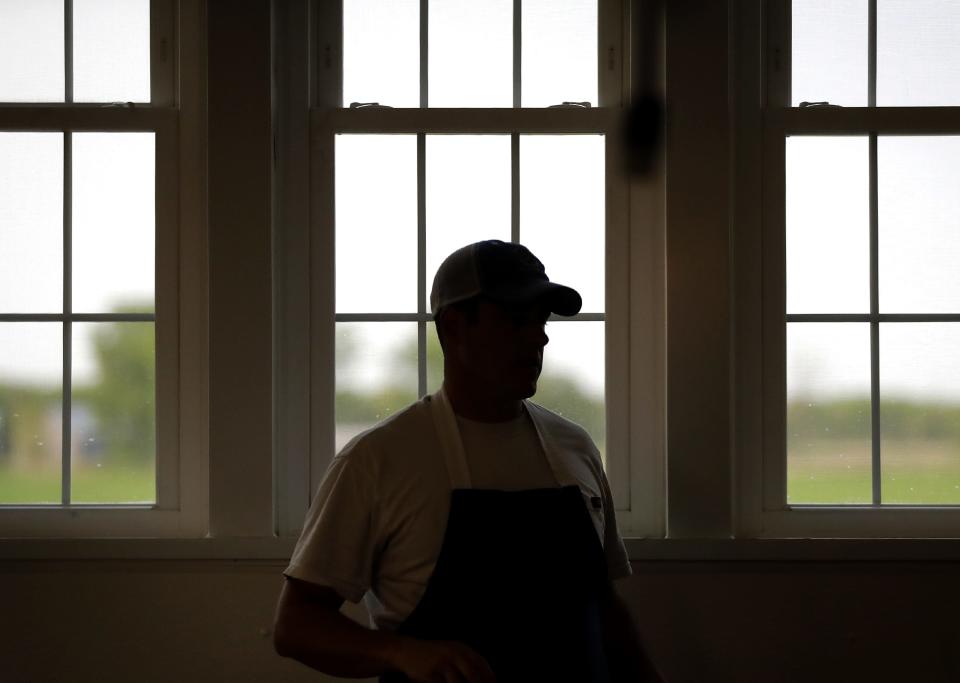 Jon Metzig observes the cheesemaking process May 23, 2023, inside Union Star Cheese Factory.