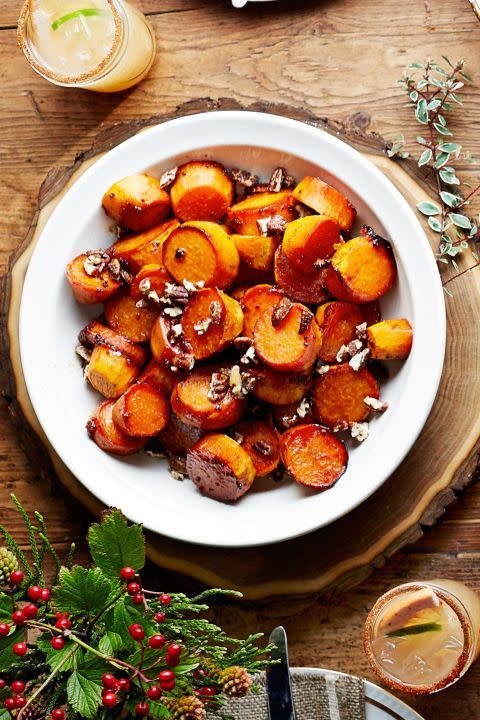 <p>Store-bought candied pecans add crunch to this comfort food dish.</p><p><strong> <a href="https://www.countryliving.com/food-drinks/recipes/a5913/sorghum-sweet-potatoes-recipe-clx1114/" rel="nofollow noopener" target="_blank" data-ylk="slk:Get the recipe;elm:context_link;itc:0;sec:content-canvas" class="link ">Get the recipe</a>.</strong></p>
