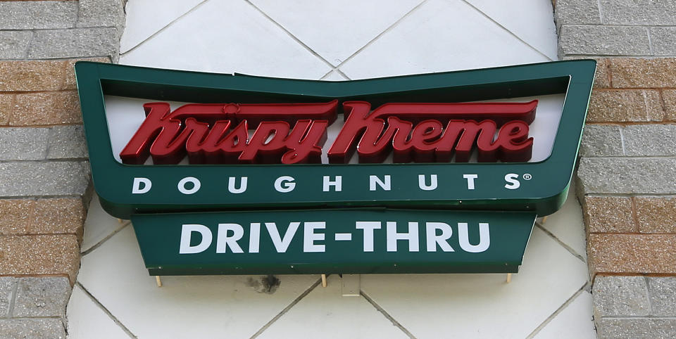 FILE - A Krispy Kreme Doughnuts sign is shown on Aug. 11, 2017, in Miami. Krispy Kreme stock jumped Tuesday, March 26, 2024, after it announced a deal where McDonald’s restaurants will sell its doughnuts across the country. (AP Photo/Alan Diaz, File)