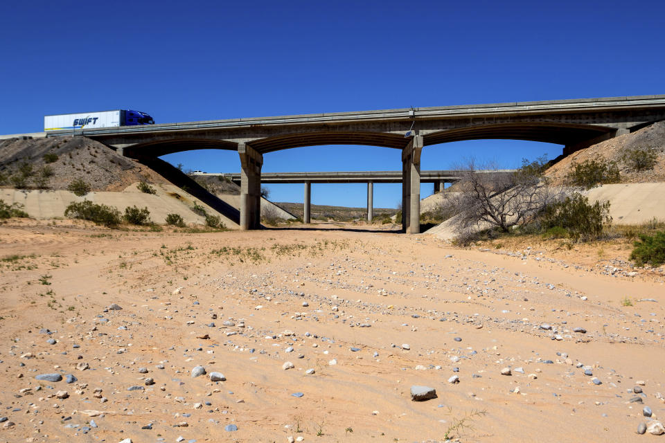 A freeway overpass where armed protesters and federal government agents stared each other down through rifle sights 10 years ago is seen Tuesday, April 9, 2024, in Mesquite, NV. Ten years have passed since hundreds of protesters including armed riflemen answered a family call for help which forced U.S. agents and contract cowboys to abandon an effort to round up family cattle in a dispute over grazing permits and fees. Despite federal prosecutions, no family members were convicted of a crime. (AP Photo/Ty ONeil)