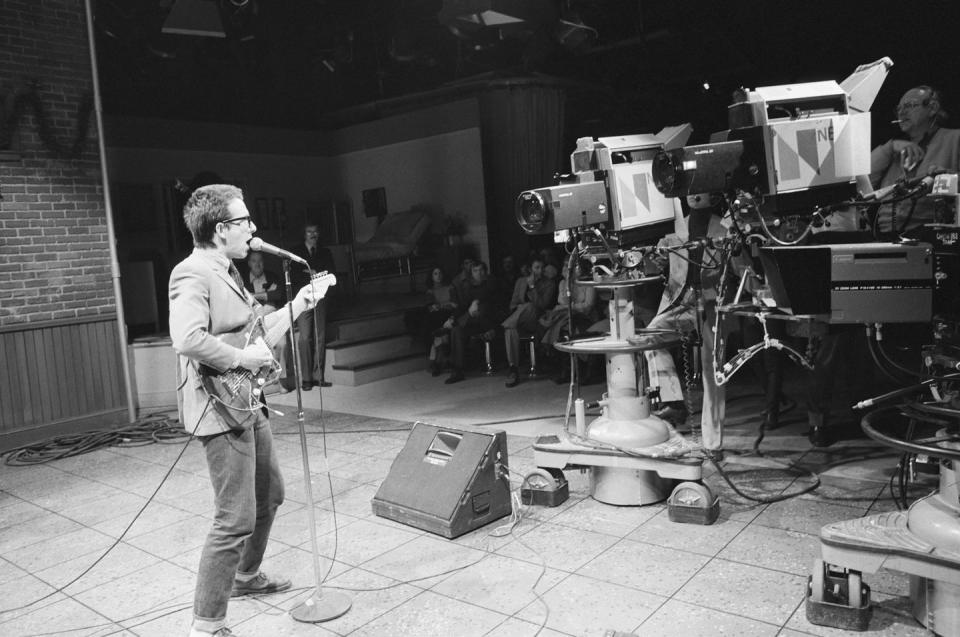 <p>As a musical guest in 1977, a young Elvis Costello surprised the <em>SNL</em> crew and censors when he stopped his band seconds into playing “Less Than Zero” and started up “Radio Radio.” A little over twenty years later, on <em>SNL</em>'s 25th anniversary show, he recalled the infamous episode by interrupting the Beastie Boys and leading everyone in a group performance of "Radio Radio."</p>