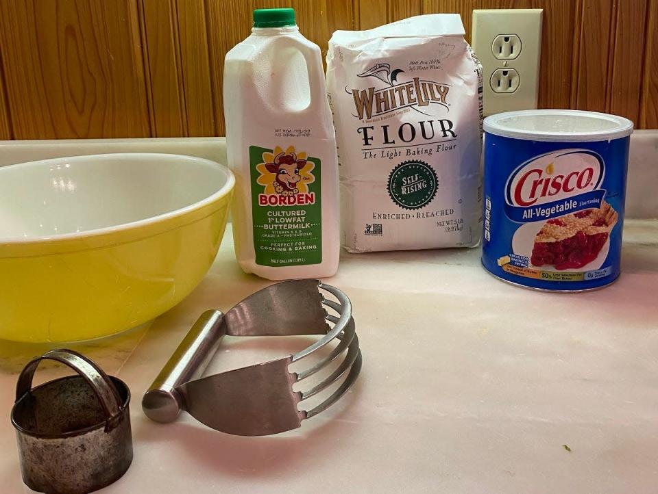 ingredients for pippa's family biscuits on a counter with a bowl and pastry cutter