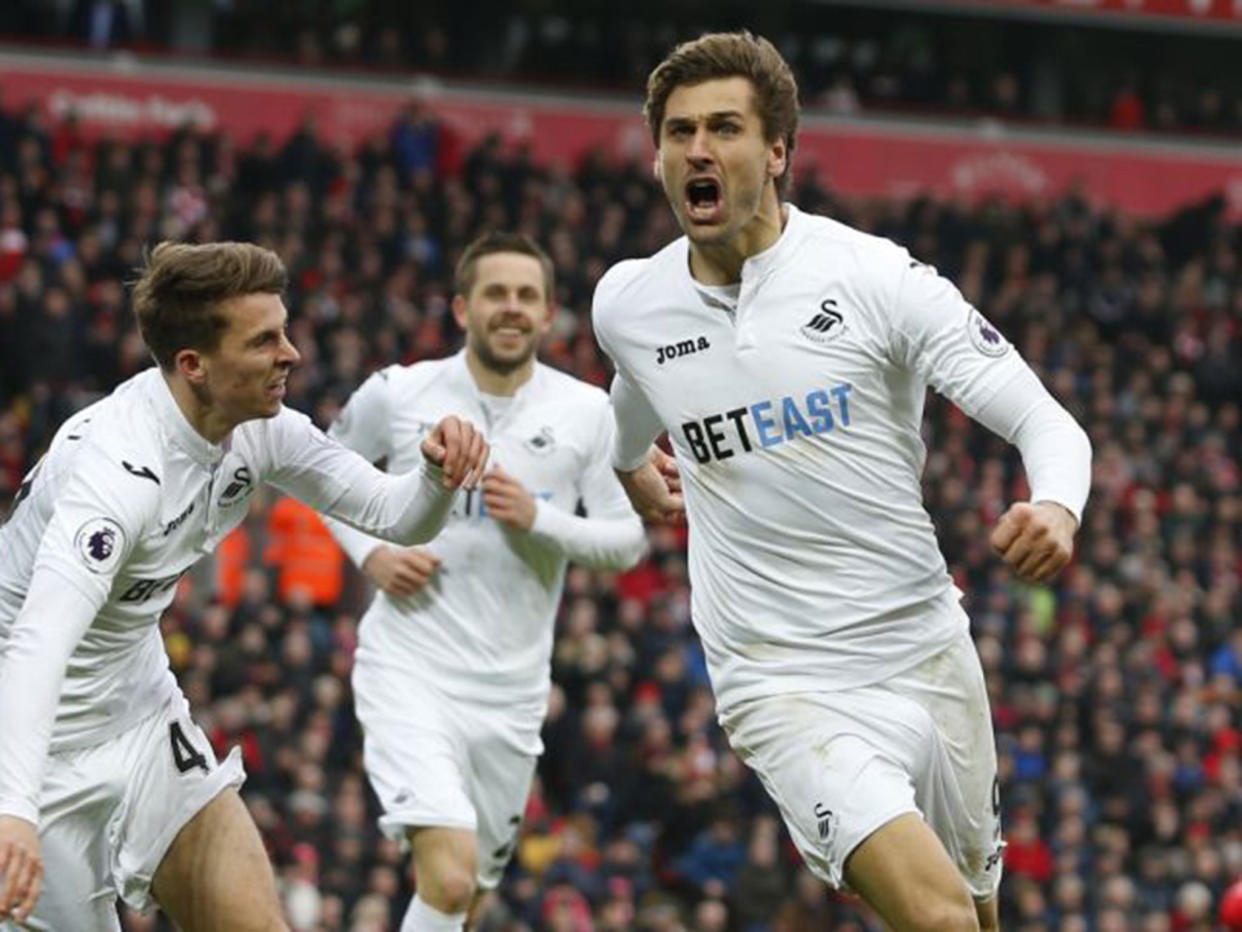 Fernando Llorente celebrates after scoring his second goal against Liverpool: Reuters