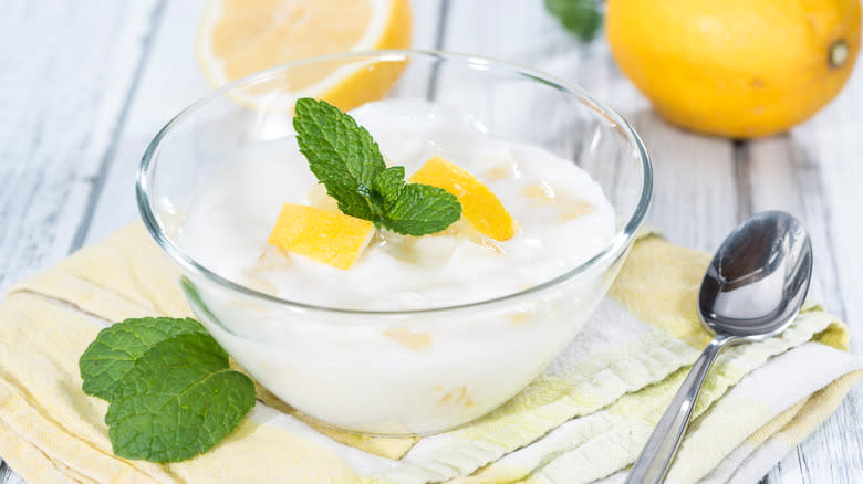 yogurt with fresh lemon juice in glass bowl