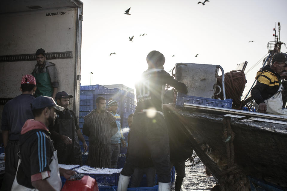 FILE - Fish is displayed for merchants inside the main port in Dakhla city, Western Sahara, Monday, Dec. 21, 2020. A legal adviser to the European Union’s top court has recommended that it annul Europe's fishing agreement with Morocco, which would have allowed European boats to fish for valuable catch off the coast of the disputed Western Sahara. (AP Photo/Mosa'ab Elshamy, File)