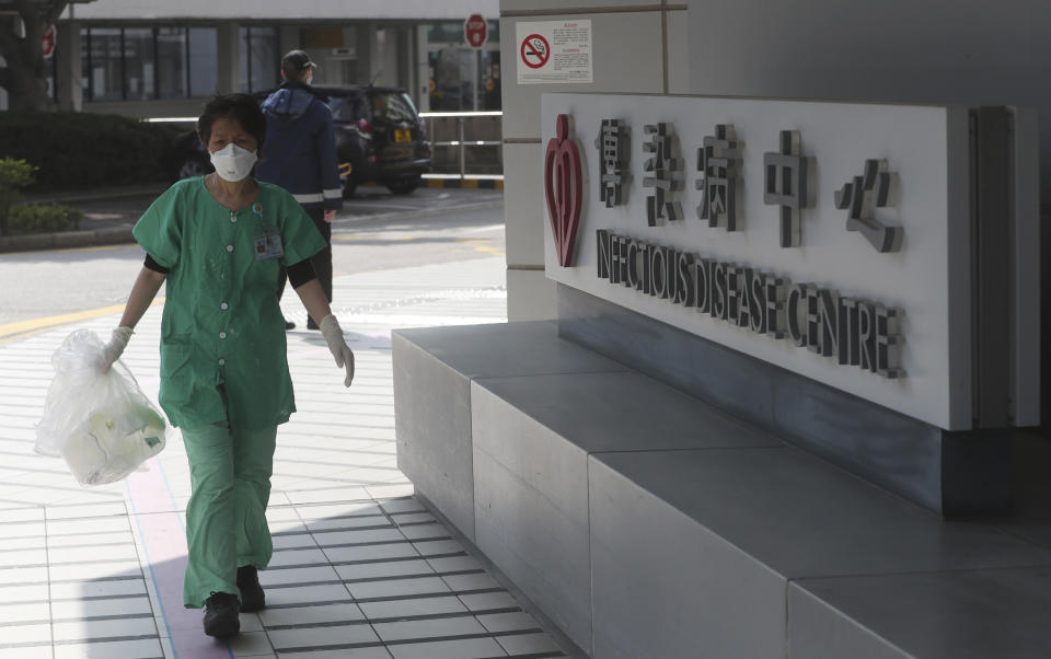 A medical staff passes the infectious disease centre at the Princess Margaret Hospital in Hong Kong, Saturday, Feb, 1, 2020. China’s death toll from a new virus continues to rise as a World Health Organization official says other governments need to prepare for“domestic outbreak control” if the disease spreads. (AP Photo/Achmad Ibrahim)