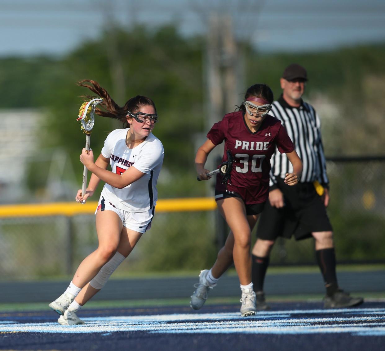 Wappingers' Kaylee Reaves drives on Ossining defender Solana Strippoli during a Section 1 Class A quarterfinal on May 19, 2023.