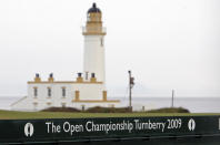 FILE - This July 2, 2009, file photo, shows the Turnberry Lighthouse on the Ailsa Course at the Turnberry golf course in Scotland. Trump is returning to a family business ravaged by pandemic shutdowns, with revenue plunging more than 40 percent at his Doral golf property, his Washington hotel and at both his Scottish resorts. Trump’s financial disclosure released as he left office this week was just the latest bad news for his financial empire after banks, brokerages and golf organizations announced they were cutting ties with his company following the storming of the Capitol this month by his political supporters (AP Photo/Scott Heppell, File)