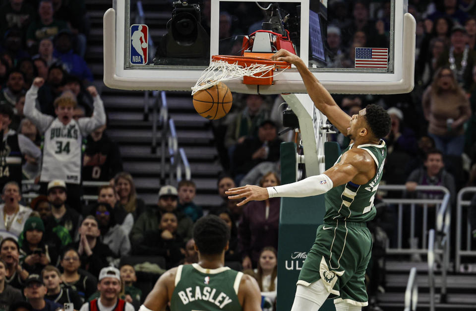 Milwaukee Bucks' Giannis Antetokounmpo dunks against the Indiana Pacers during the first half of an NBA basketball game, Monday, Jan. 1, 2024, in Milwaukee. (AP Photo/Jeffrey Phelps)