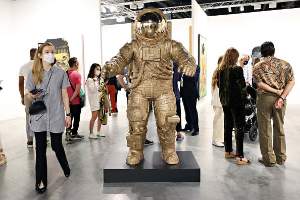 <div class="inline-image__caption"><p>Guests view art on display at the Art Basel Miami Beach VIP Preview 2021 at Miami Beach Convention Center on November 30, 2021 in Miami Beach, Florida.</p></div> <div class="inline-image__credit">Cindy Ord/Getty Images</div>