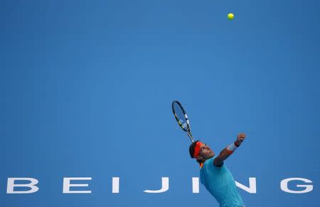 Rafael Nadal of Spain serves to Peter Gojowczyk of Germany during their men's singles match at the China Open tennis tournament in Beijing October 2, 2014. REUTERS/Petar Kujundzic
