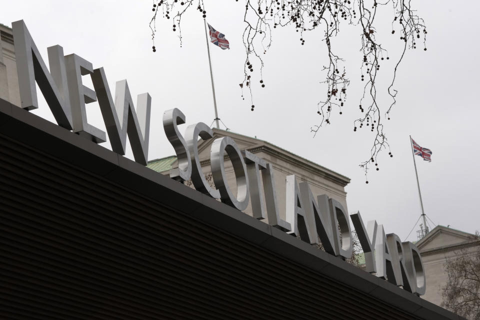 A sign outside New Scotland Yard, the headquarters of the London Metropolitan Police, in London, Tuesday, March 21, 2023. An independent review says London police have lost the confidence of the public because of deep-seated racism, misogyny and homophobia. The report released Tuesday was commissioned after a young woman was raped and killed by a serving officer. (AP Photo/Kirsty Wigglesworth)