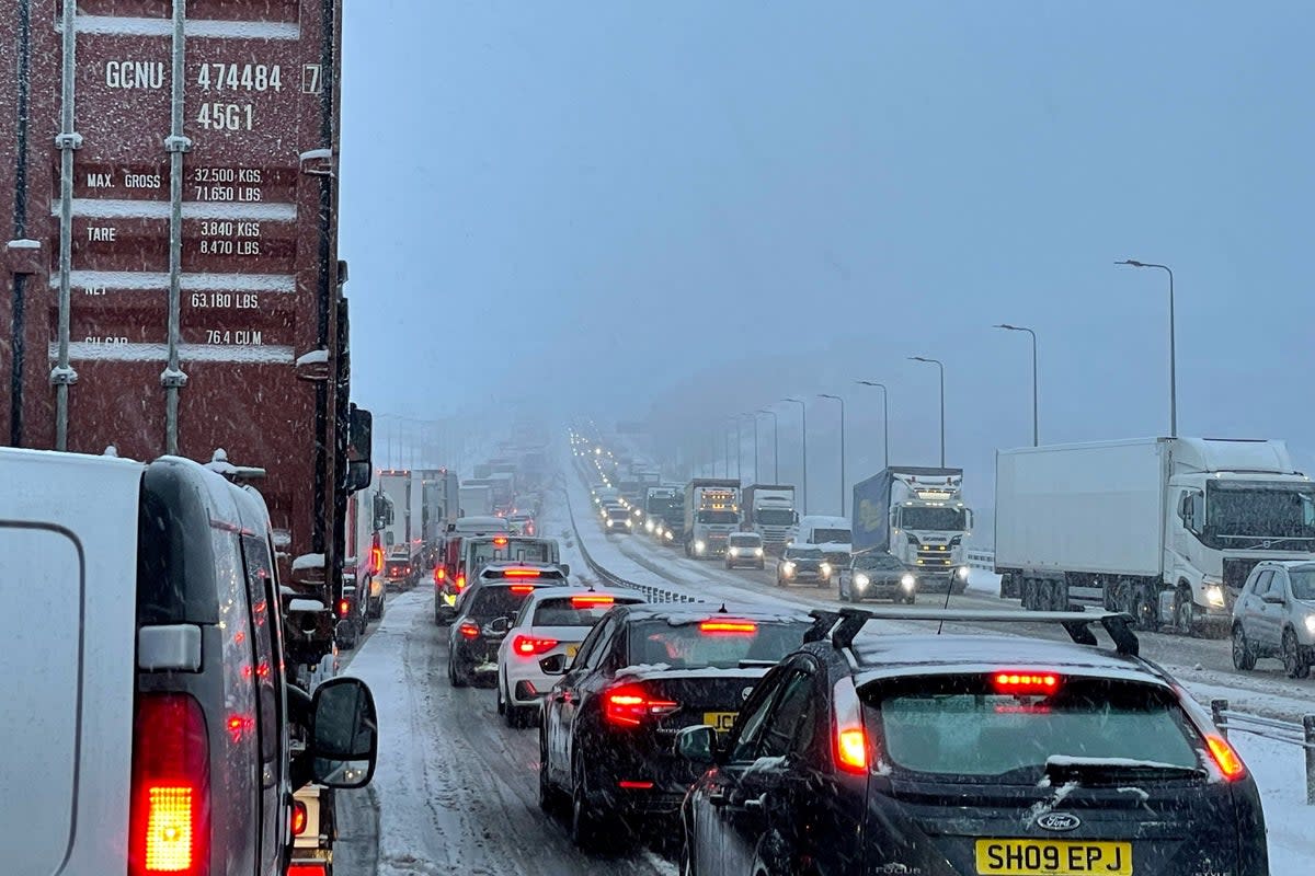 Traffic at a standstill on the M62 motorway near Kirklees, West Yorkshire, due to heavy snow in the area (PA) (PA Wire)