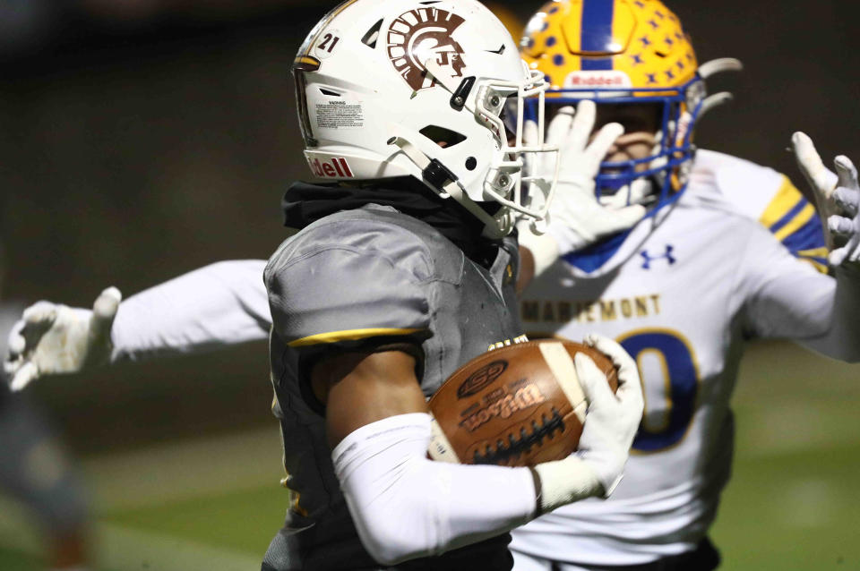 Roger Bacon wide receiver Beamer Walker returns a punt during the Spartan playoff game against Mariemont, Saturday, Nov. 6, 2021.