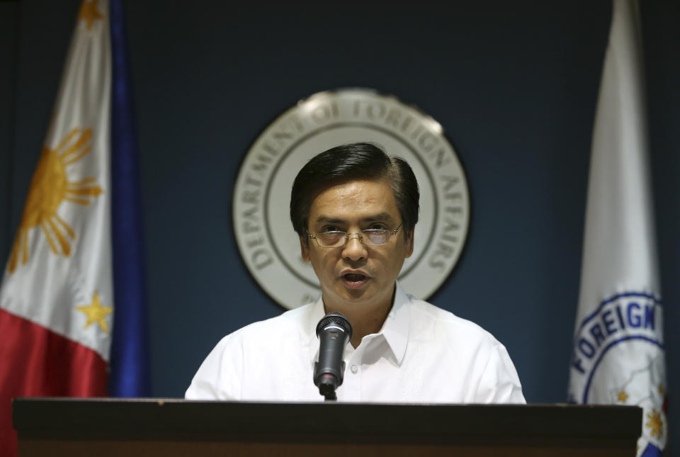 Philippine Department of Foreign Affairs Spokesman Charles Jose delivers a statement about the Philippine protest against China's reclamation of land in a disputed reef in the South China Sea as he faces the media at the Philippine Foreign Affairs headquarters in suburban Pasay, south of Manila, Philippines on Wednesday, May 14, 2014. The Philippines has protested China's reclamation of land in a disputed reef in the South China Sea that can be used to build an airstrip or an offshore military base in the increasingly volatile region, the country's top diplomat and other officials said. (AP Photo/Aaron Favila)