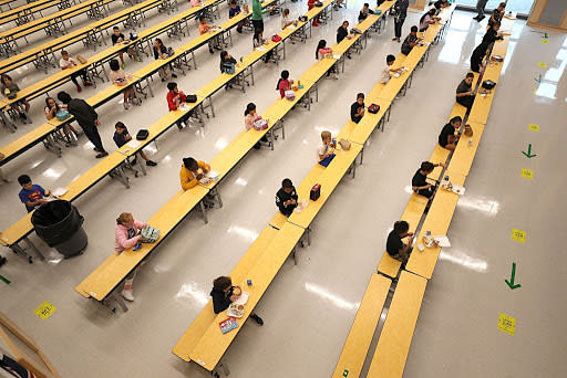 Sept. 11 Children are spaced apart in a room used for lunch at Woodland Elementary School in Milford, Massachusetts. (Getty Images)