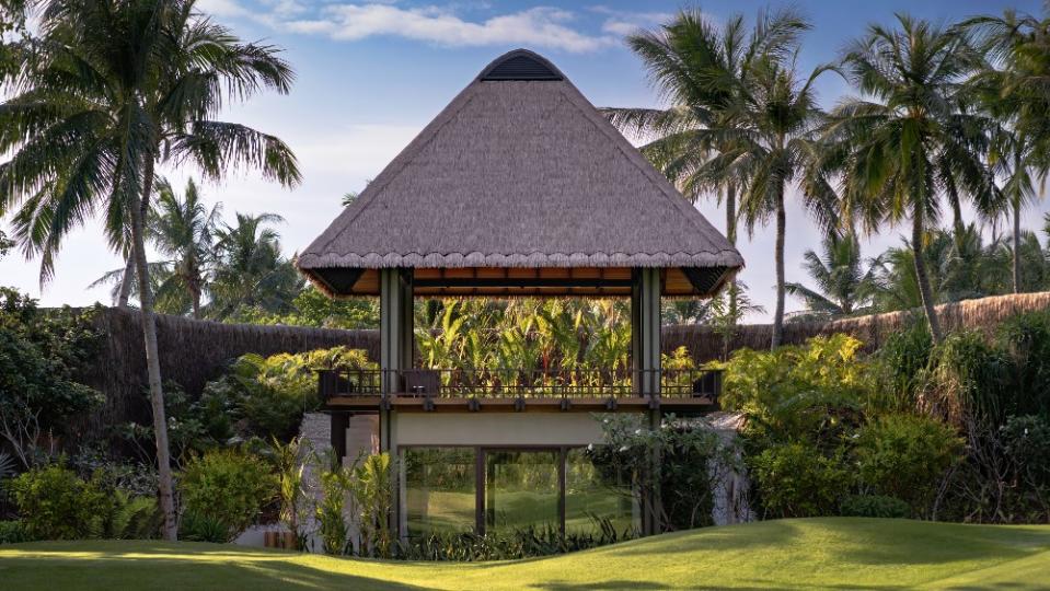 A thatched yoga pavilion