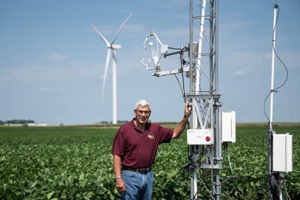 Jerry Hatfield, a retired U.S. Department of Agriculture scientist, poses for a photo next to a series of instruments that measures the amount of carbon evaporating from a central Iowa soybean field, on Wednesday, July 19, 2023.