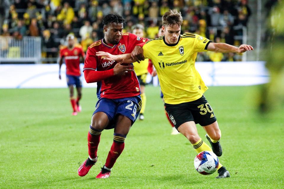 Apr 1, 2023; Columbus, Ohio, United States;  Columbus Crew defender Will Sands (30) drives up the side of the field while defended by Real Salt Lake defender Luis Rivera (25) during the second half of the MLS soccer game between Columbus Crew and Real Salt Lake at Lower.com Field on Saturday night. Mandatory Credit: Joseph Scheller-The Columbus Dispatch