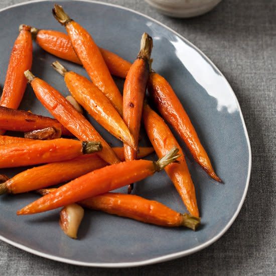 <p>Carrots, water, garlic cloves, canola oil, unsalted butter, salt, and pepper are all you need to make this easy recipe.</p><p><a href="https://www.foodandwine.com/recipes/whole-roasted-carrots-with-garlic" rel="nofollow noopener" target="_blank" data-ylk="slk:GO TO RECIPE;elm:context_link;itc:0;sec:content-canvas" class="link ">GO TO RECIPE</a></p>