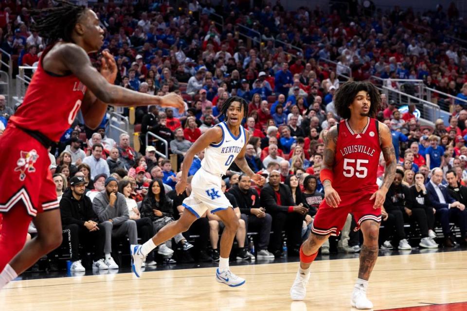 Kentucky guard Rob Dillingham (0) talks to Louisville guard Mike James (0) after scoring against him in the first half Thursday at the KFC Yum Center. Silas Walker/swalker@herald-leader.com