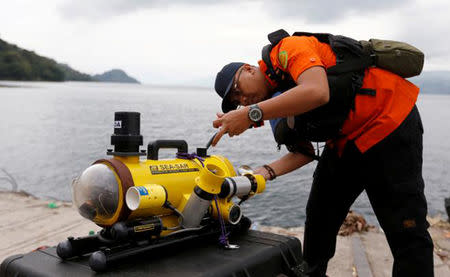 A rescue personnel prepares a ROV before starting to find the location of the Lion Air plane crash in the sea in Karawang regency, West Java province Indonesia, October 29, 2018. Antara Foto/Handout/Basarnas via REUTERS