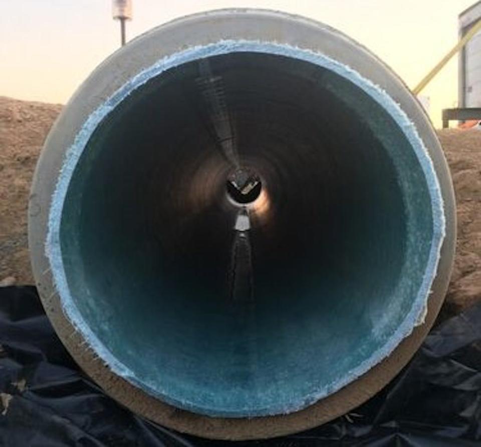 The blue cured-in-place pipe, or CIPP, can be seen inside this damaged storm sewer pipe. The CIPP was created by steam cooking the resin into the hard plastic. Andrew Whelton/Purdue University