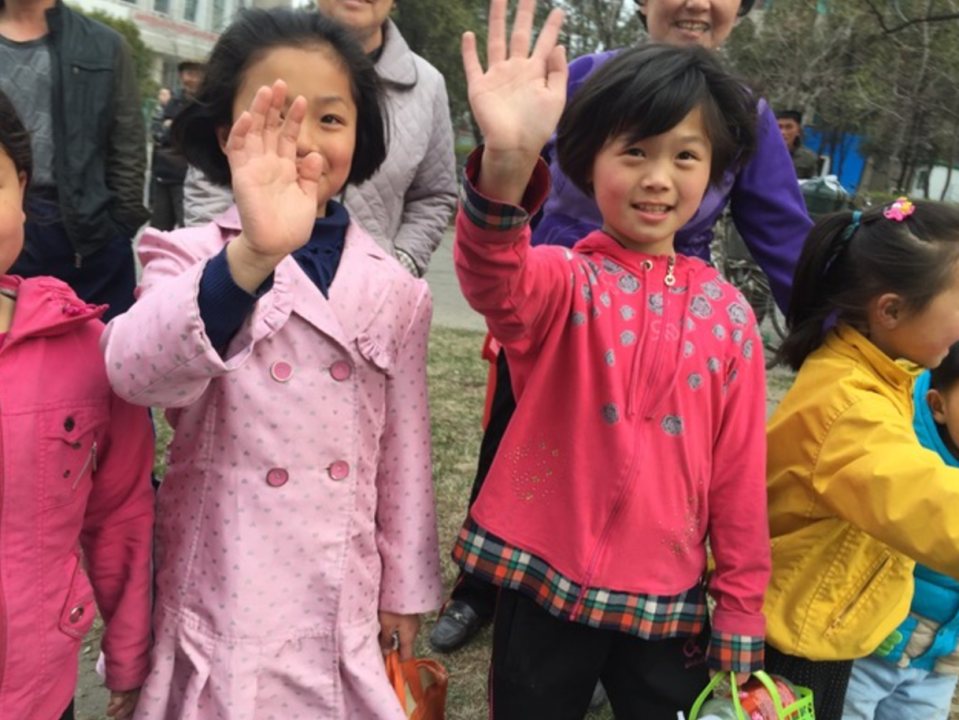 Children line the streets of Pyongyang to cheer on the marathon runners. (Courtesy Kathy Whitmer)