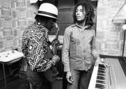 <p>Aston 'Family Man' Barrett and Bob Marley of The Wailers playing guitar and keyboards backstage at the Odeon, Birmingham, United Kingdom, July 18, 1975.</p>