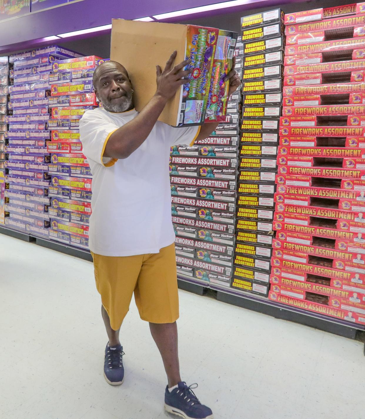 Peter Brown of Massillon heads to the checkout with his boxes of fireworks at Phantom Fireworks in Canton.