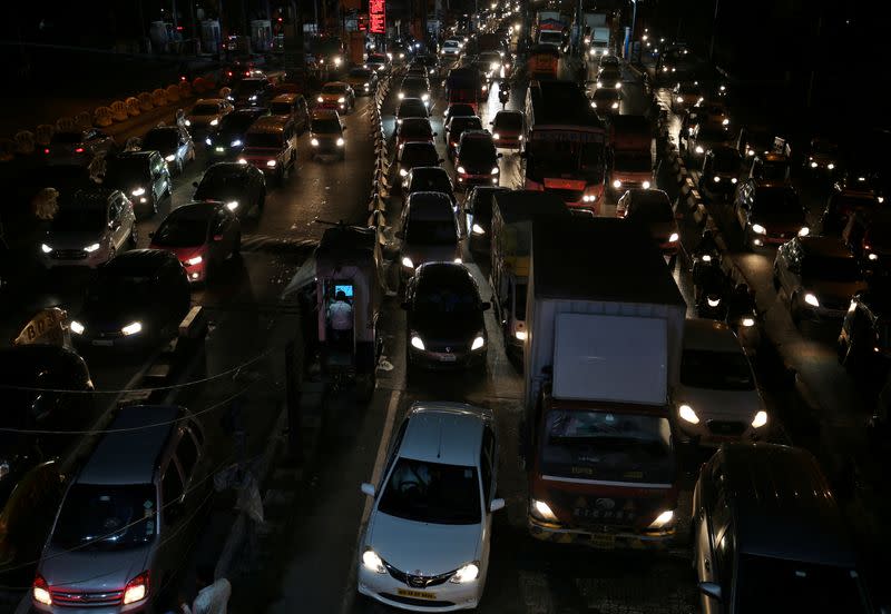 FILE PHOTO: Vehicles are pictured at a toll post in Mumbai