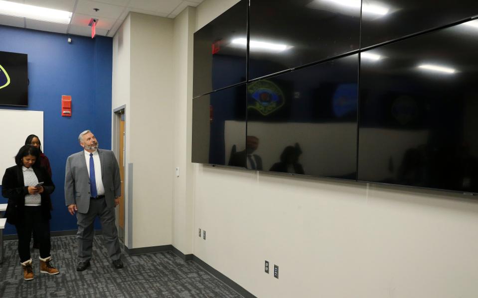 The Tuscaloosa Police Department showed off some of the features of the renovated police headquarters building Friday, Nov. 5, 2021. Captain Phil Simpson talks about the wall of video monitors in the command center. Ultimately they will be linked to the command center at City Hall and at Tuscaloosa Fire Rescue. [Staff Photo/Gary Cosby Jr.]